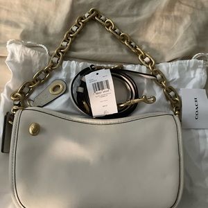 Coach Swinger Bag with chain and crossbody strap.